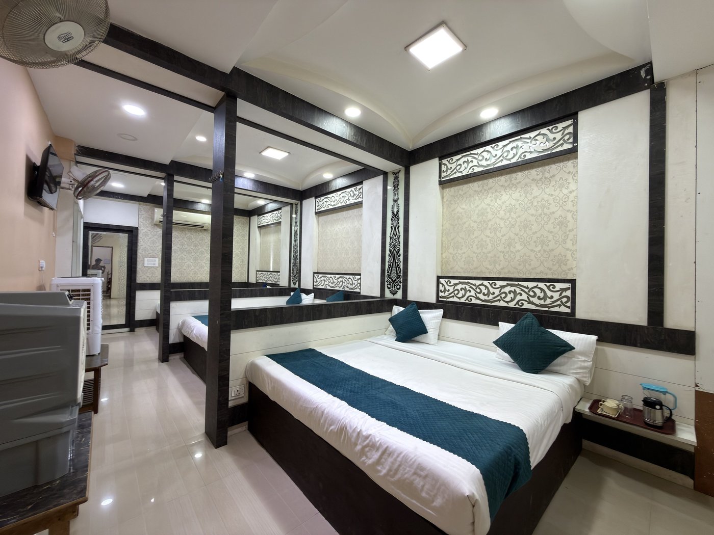 Comfortable guest room interior at Shree Aksharam Guest House