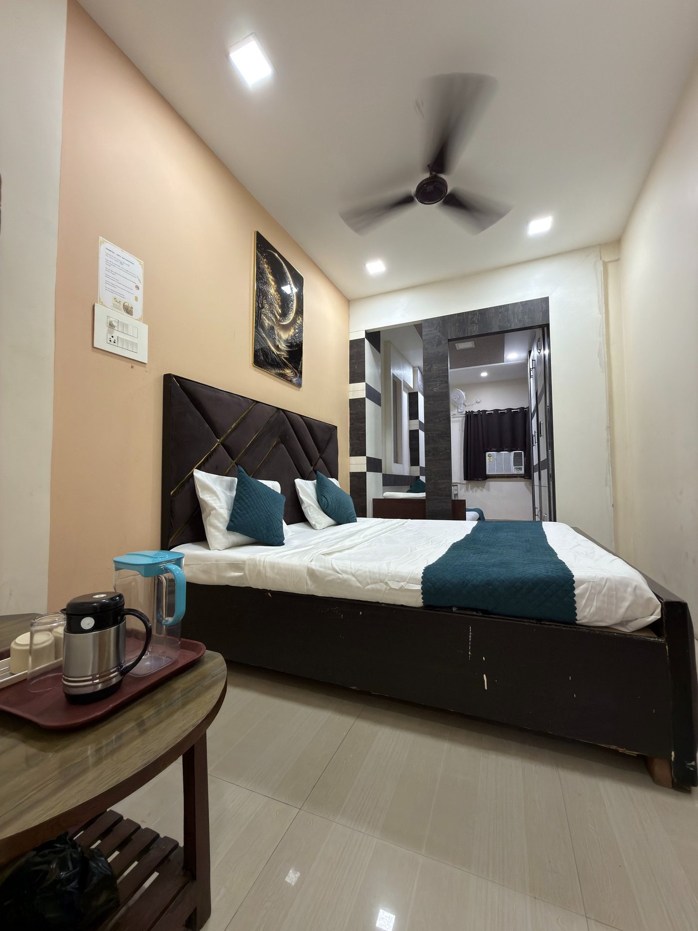 Spacious deluxe room with black and gold accents